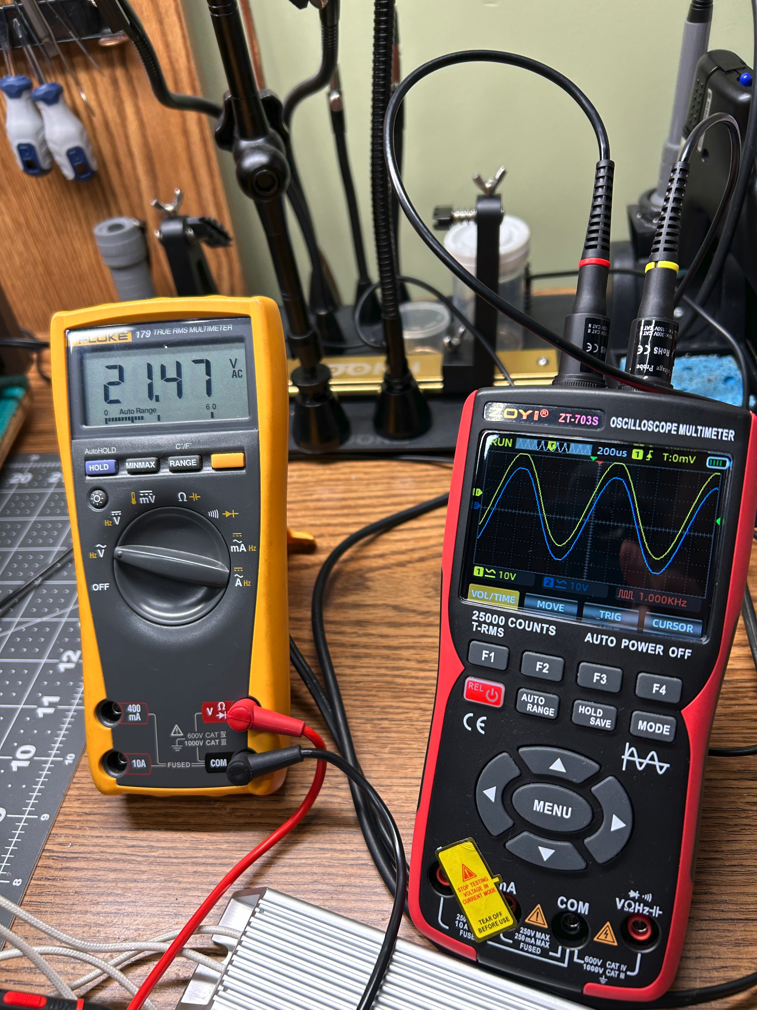 Fluke meter and oscilloscope during full-power Pioneer SX-828 bench testing